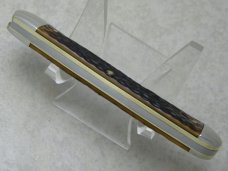 Western USA S-693 D Jigged Delrin Linerlock 1 Blade Trapper Knife with Raccoon Etch c.1980
