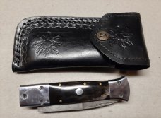 Hand made damascus switchblade with buffalo horn handles.