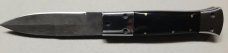 Hand made damascus switchblade with buffalo horn handles.