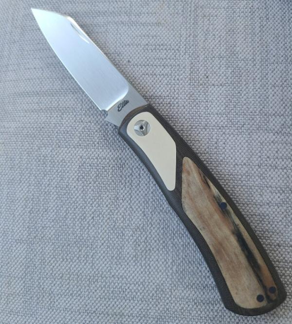 Johan Ellis Native 4".Raffir inlays.Paper Micarta Bolsters..Canvas Frame. G10 & titanium liners.