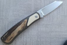 Johan Ellis Native 4".Raffir inlays.Paper Micarta Bolsters..Canvas Frame. G10 & titanium liners.