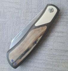 Johan Ellis Native 4".Raffir inlays.Paper Micarta Bolsters..Canvas Frame. G10 & titanium liners.