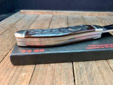 Winchester by Queen Sowbelly Brown Old Utica Bone 1989