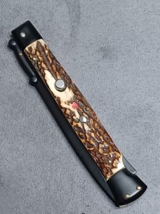 11" Stag scales Italian Stiletto swinguard. Frank Beltrame Dagger Teflon coated blade. Flat button. 