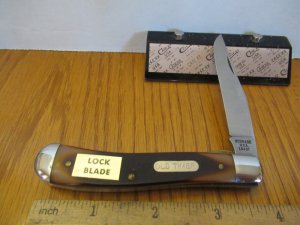 Schrade Rough Saw Cut Delrin USA Made Gunstock LinerLock Trapper Model 194OT