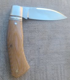 Cosimo Benedetto Dino Slipjoint...Fluted bolsters.. Rwl34..3.75 closed...Canvas MIcarta..coa & slip 