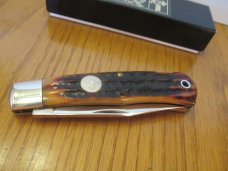 Queen Titusville PA. Amber Carved Stag Bone Mountain Man Pattern # 3