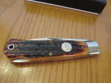 Queen Titusville PA. Amber Carved Stag Bone Mountain Man Pattern # 3