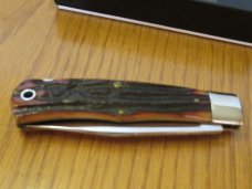 Queen Titusville PA. Amber Carved Stag Bone Mountain Man Pattern # 3