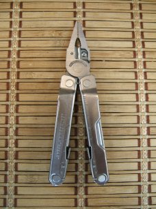 LEATHERMAN REBAR SILVER MULTI-TOOL PORTLAND OR. NEAR MINT NEVER USED OR CARRIED CONDITION W/17 TOOLS