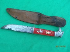 The Scary Chicken Head Knife with Green Eyes