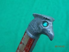 The Scary Chicken Head Knife with Green Eyes
