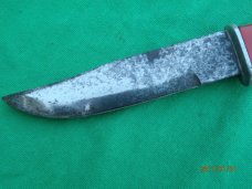The Scary Chicken Head Knife with Green Eyes