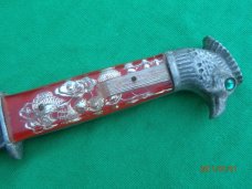 The Scary Chicken Head Knife with Green Eyes