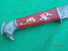The Scary Chicken Head Knife with Green Eyes