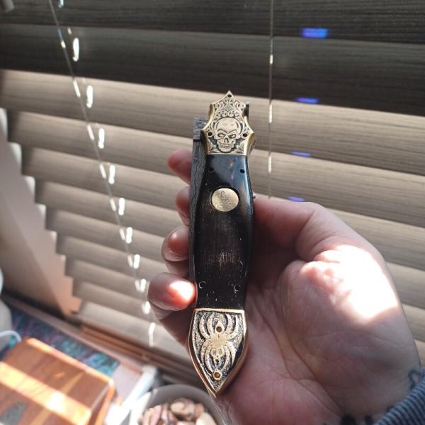Muhammad Afaaq brass switchblade 