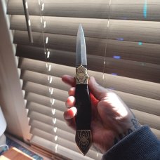 Muhammad Afaaq brass switchblade 