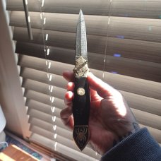 Muhammad Afaaq brass switchblade 