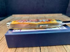 Schatt and Morgan Premier Series Humpback Whittler Golden Root Jigged Bone
