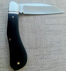 K'roo El Zorro Slipjoint...Black Micarta.."Z" white shield...fluted bolsters..Coa & Slip..4 clsd