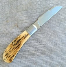 Jennings Raptor..Mammoth Ivory and Cpm154..Ringed bolsters..arrowhead shield..coa & box. 3.5"