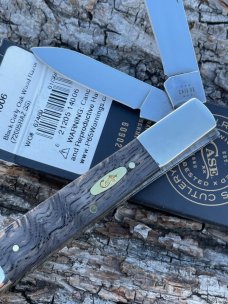 CASE XX ** 2024 SMOOTH BLACK CURLY OAK BRASS SHIELD RAZOR