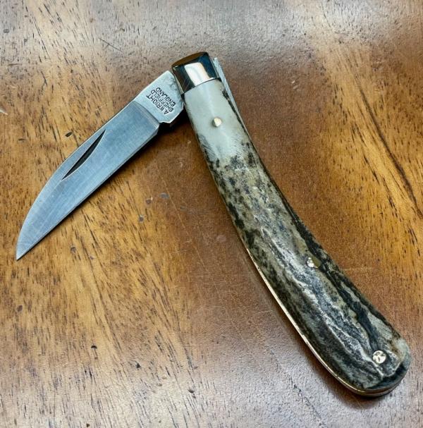 A Wright & Son "Ettrick" Carving Knife with Stag Handles and Curved Wharncliffe Blade