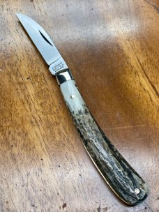 A Wright & Son "Ettrick" Carving Knife with Stag Handles and Curved Wharncliffe Blade