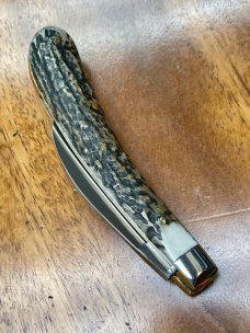 A Wright & Son "Ettrick" Carving Knife with Stag Handles and Curved Wharncliffe Blade