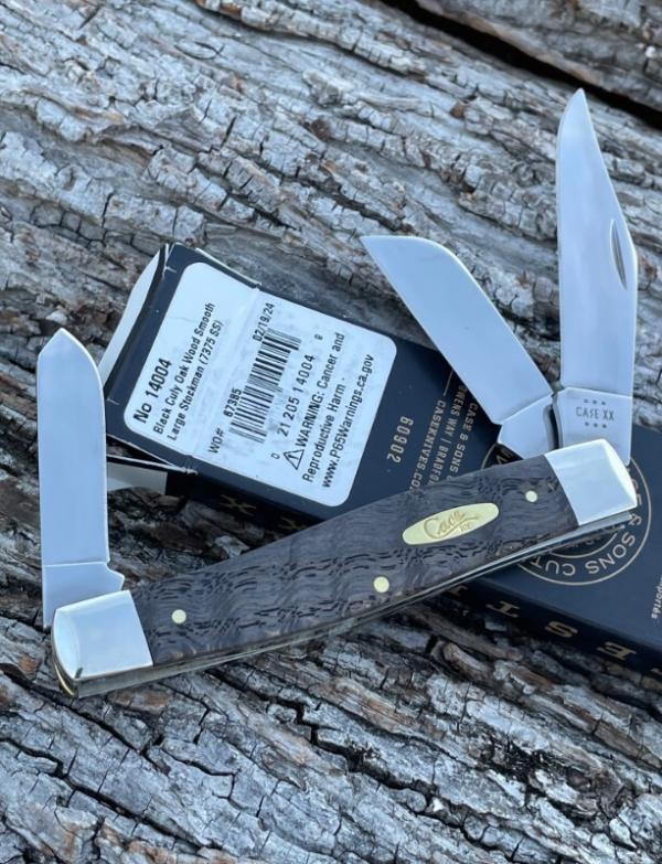 CASE XX ** 2024 SMOOTH BLACK CURLY OAK WOOD BRASS SHIELD LARGE STOCKMAN CASE XX ** 2024 SMOOTH BLACK CURLY OAK WOOD BRASS SHIELD LARGE STOCKMAN