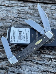 CASE XX ** 2024 SMOOTH BLACK CURLY OAK WOOD BRASS SHIELD LARGE STOCKMAN