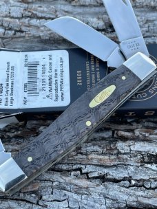 CASE XX ** 2024 SMOOTH BLACK CURLY OAK WOOD BRASS SHIELD LARGE STOCKMAN