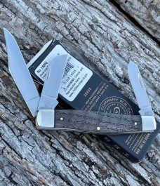 CASE XX ** 2024 SMOOTH BLACK CURLY OAK WOOD BRASS SHIELD LARGE STOCKMAN