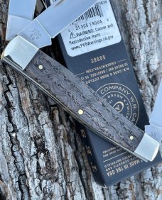 CASE XX ** 2024 SMOOTH BLACK CURLY OAK WOOD BRASS SHIELD LARGE STOCKMAN