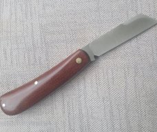 Menefee Lambsfoot Swayback..A2 steel..4" closed. .Crosscut Micarta scales...impressive swedge & pull