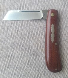 Menefee Lambsfoot Swayback..A2 steel..4" closed. .Crosscut Micarta scales...impressive swedge & pull