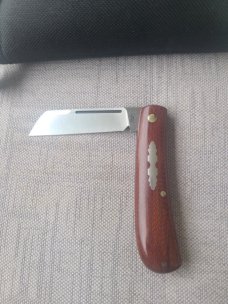 Menefee Lambsfoot Swayback..A2 steel..4" closed. .Crosscut Micarta scales...impressive swedge & pull