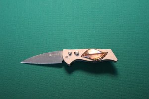 Small Switchblade - aproximatly 3" closed with 2 1/2" locking blade