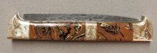13" Double Eagle Picklock Switchblade. Damascus Blade and Multi Color Acrylic handles.