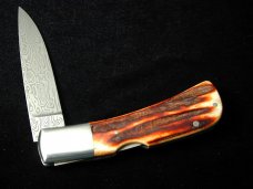 Al Warren Red Sambar Stag Drop Point Lock Back Knife Roseville CA. 3.75" Closed Damasteel Blade