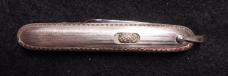 2 7/8" Flylock with etched blade and bail.