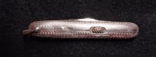 2 7/8" Flylock with etched blade and bail.