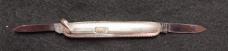 2 7/8" Flylock with etched blade and bail.