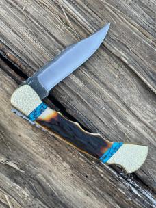 BUCK 110 FINGER GROOVE LEROY REMER CUSTOM AMBER STAG KNIFE