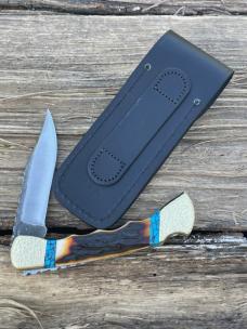BUCK 110 FINGER GROOVE LEROY REMER CUSTOM AMBER STAG KNIFE