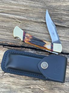 BUCK 110 LEROY REMER CUSTOM AMBER STAG KNIFE