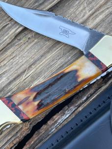 BUCK 110 LEROY REMER CUSTOM AMBER STAG KNIFE