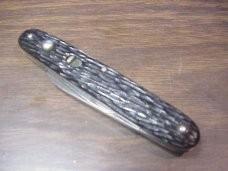 Schrade Walden medium double black jigged scales