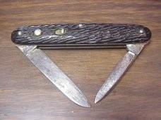 Schrade Walden medium double black jigged scales