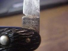 Schrade Walden medium double black jigged scales